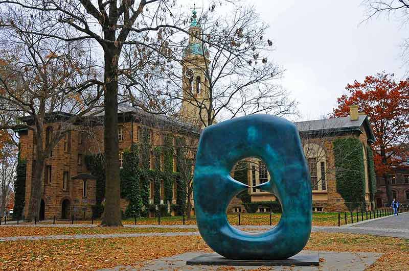 A bronze sculpture on the Princeton campus in autumn