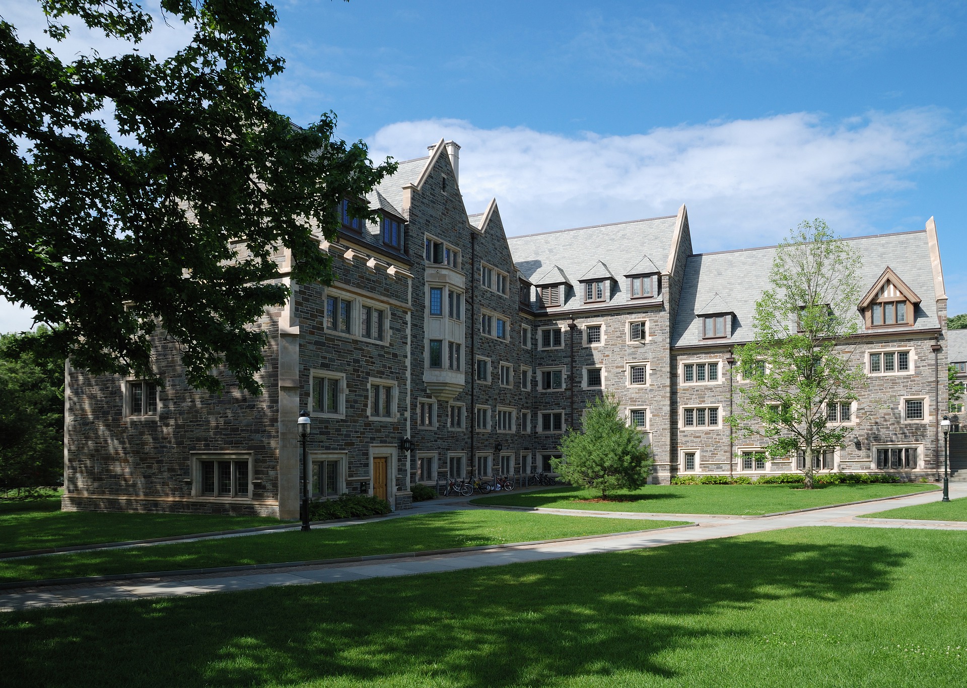 A stone collegiate building and lawn on the Princeton campus