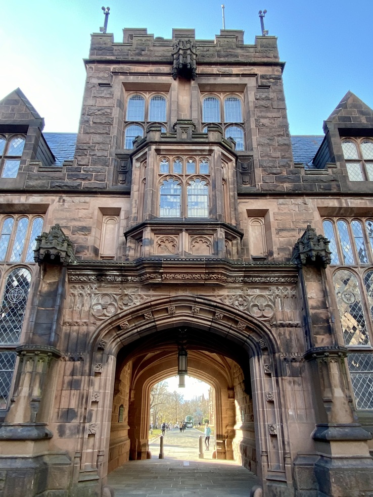 The carved brownstone archway of East Pyne Hall