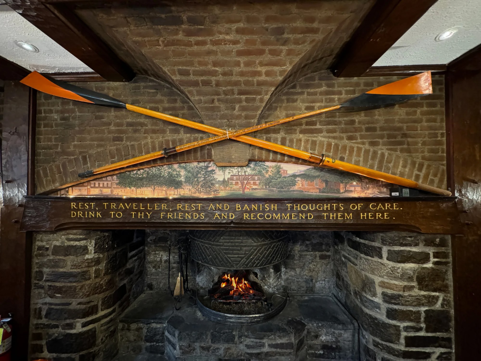 Crossed rowing oars above the tap room fireplace
