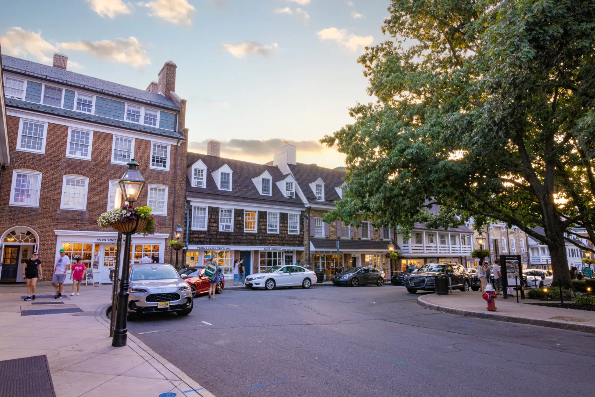 Shops and lamplight around Palmer Square at golden hour
