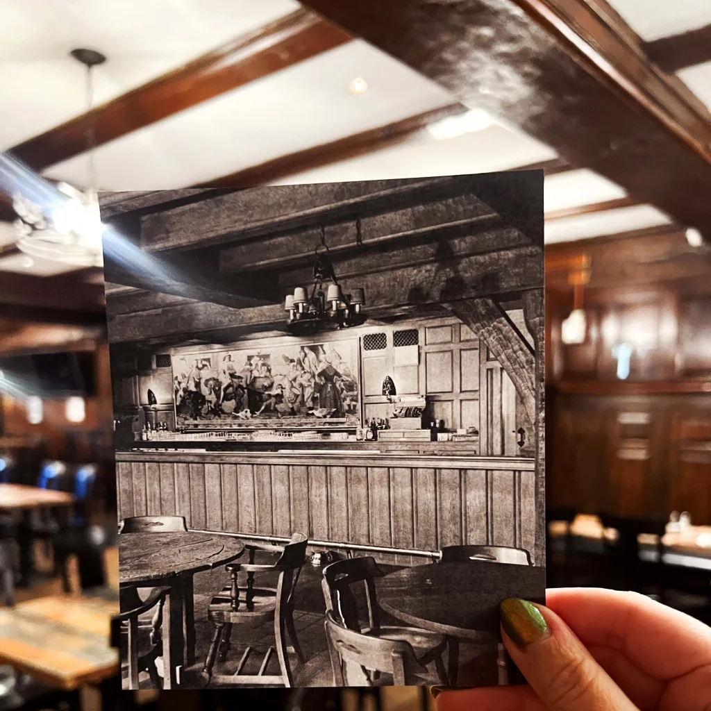 An archive photograph held up inside the tap room